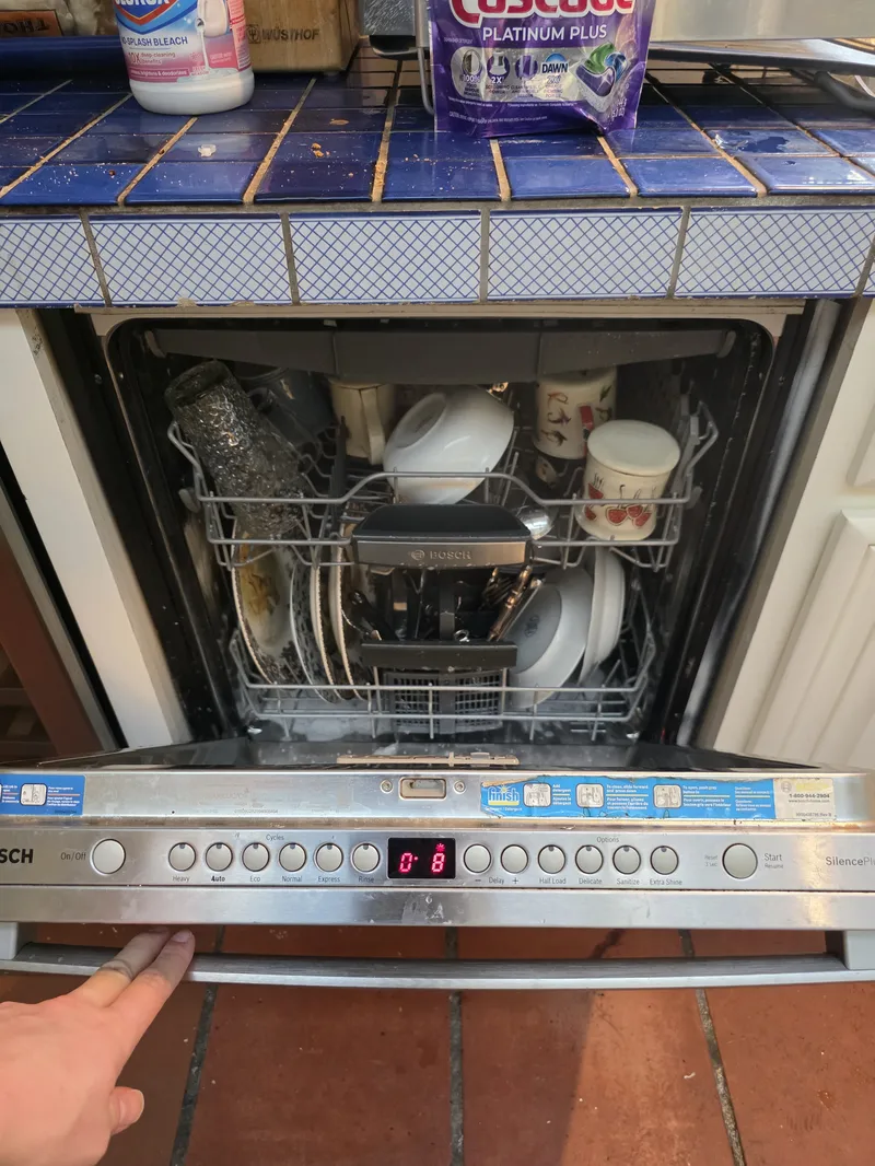 Daniil diagnosing a KitchenAid refrigerator in Marin County