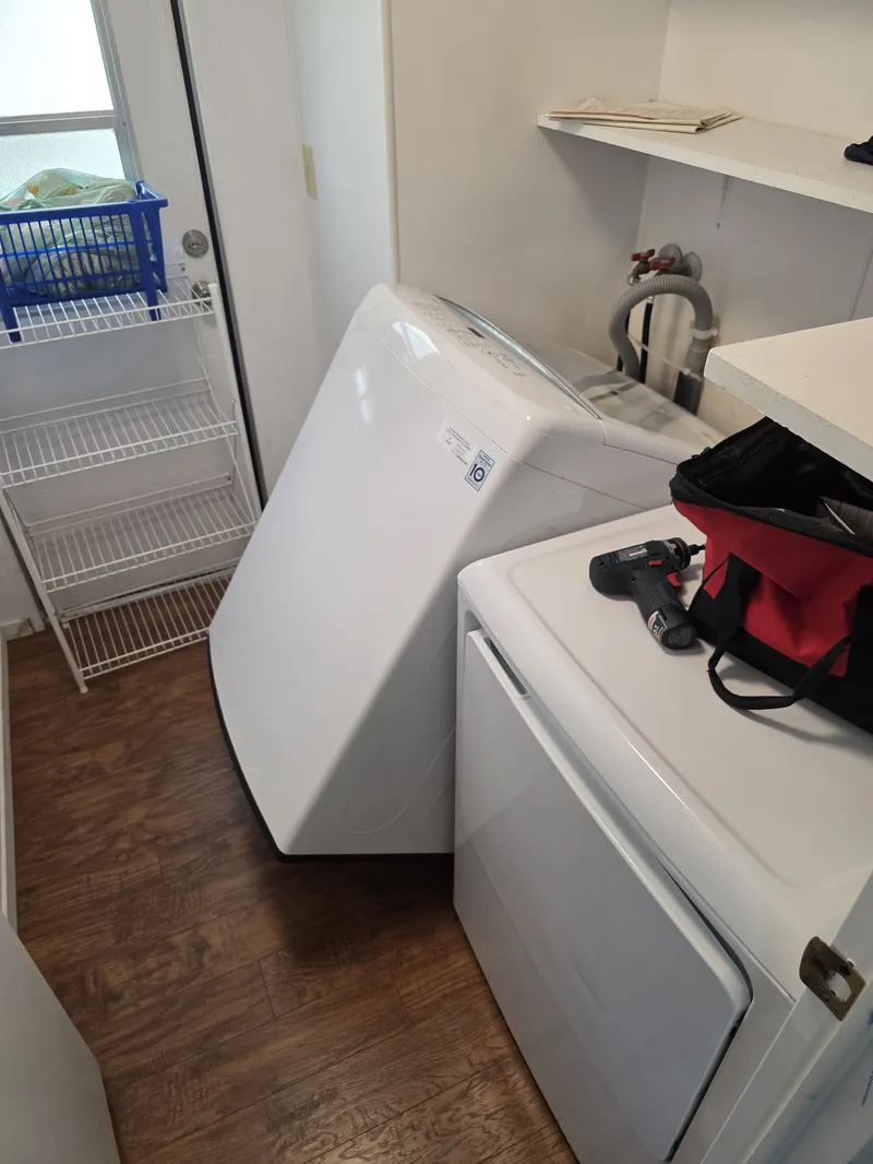 LG top-load washer pulled away from the wall for access during a San Rafael repair