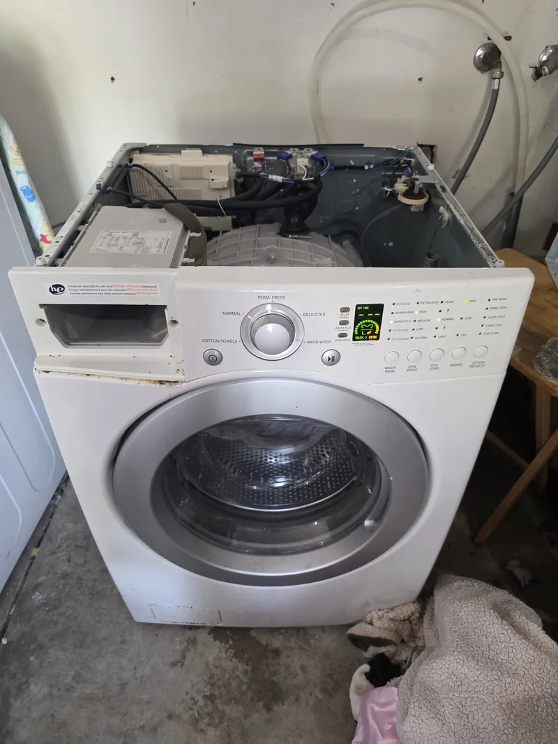 LG front-load washer opened up for control board and drain diagnostics in Marin County