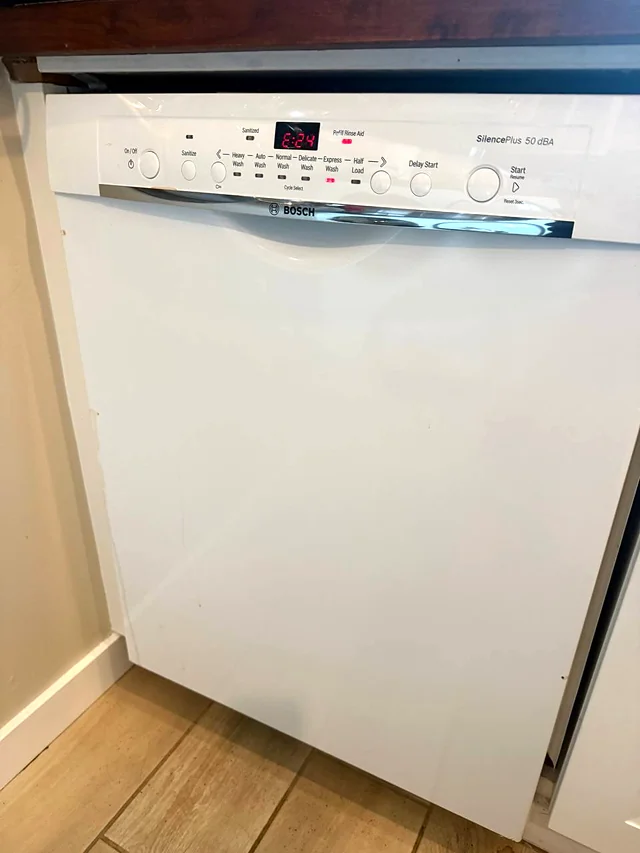 White Bosch dishwasher control panel with a red display showing error code E:24